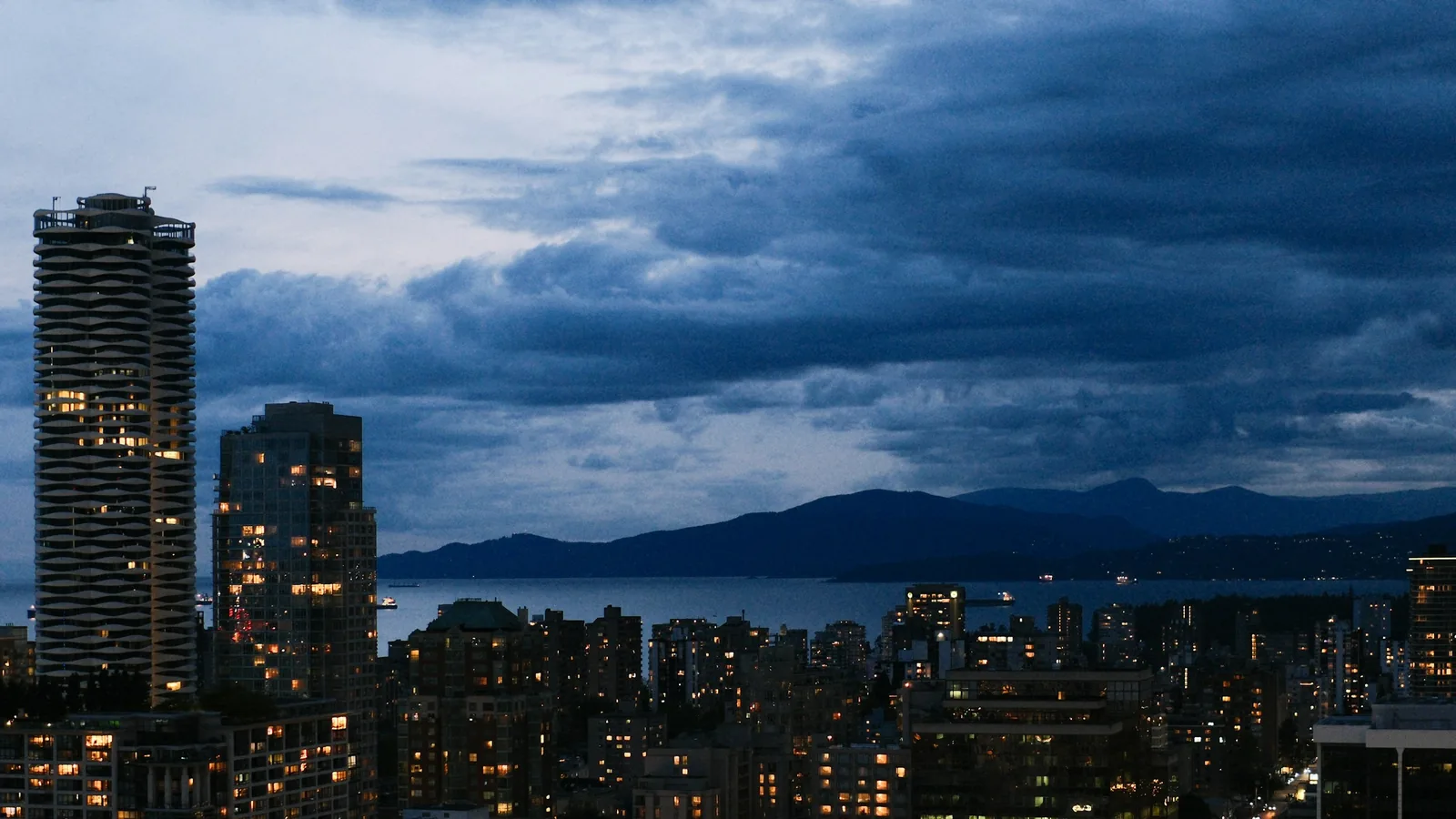 Vancouver high-rises at night looking out over English Bay