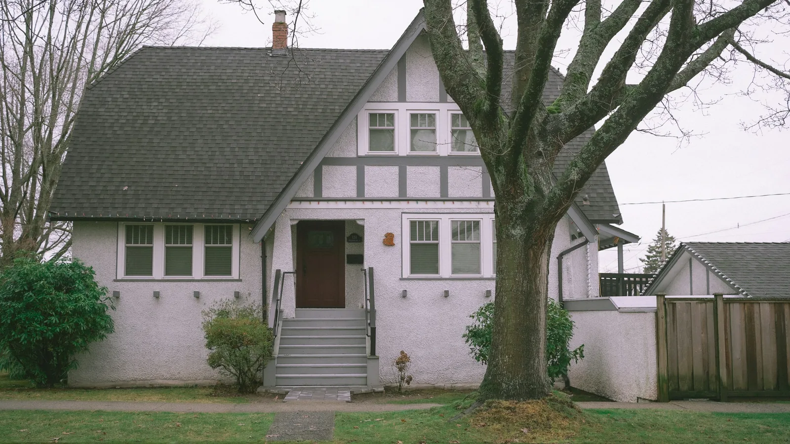 A white house with a tree in front of it, Vancouver