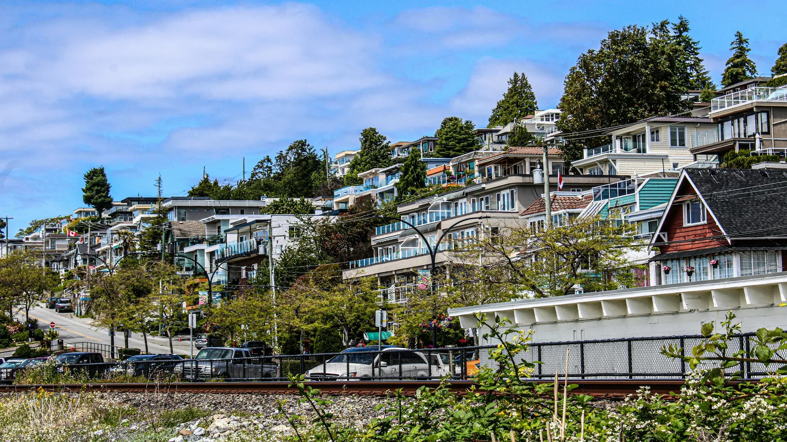 A bunch of houses that are on a hill, the White Rock waterfront