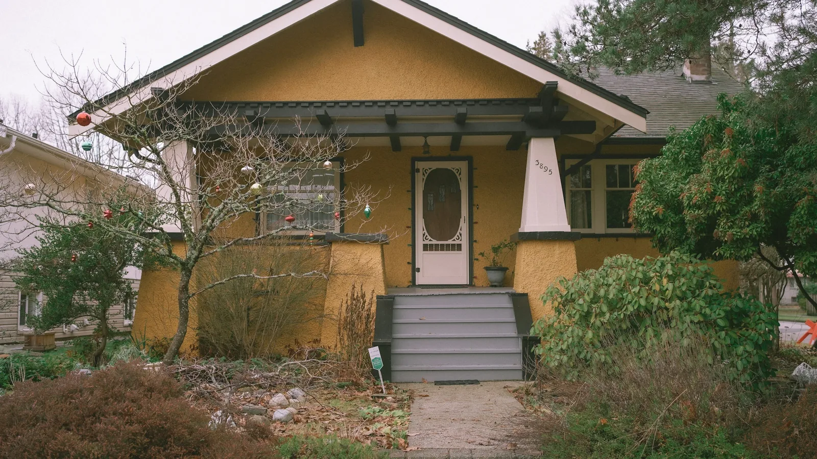 A yellow house with a white front door, Vancouver