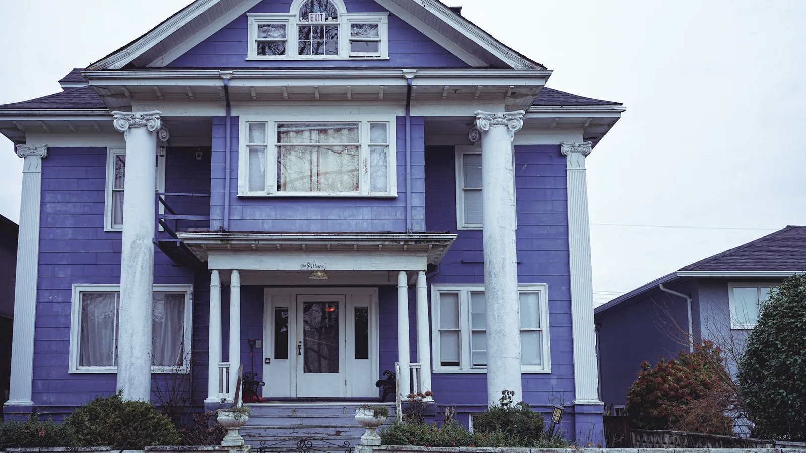 A purple house with white trim and a white door, Vancouver