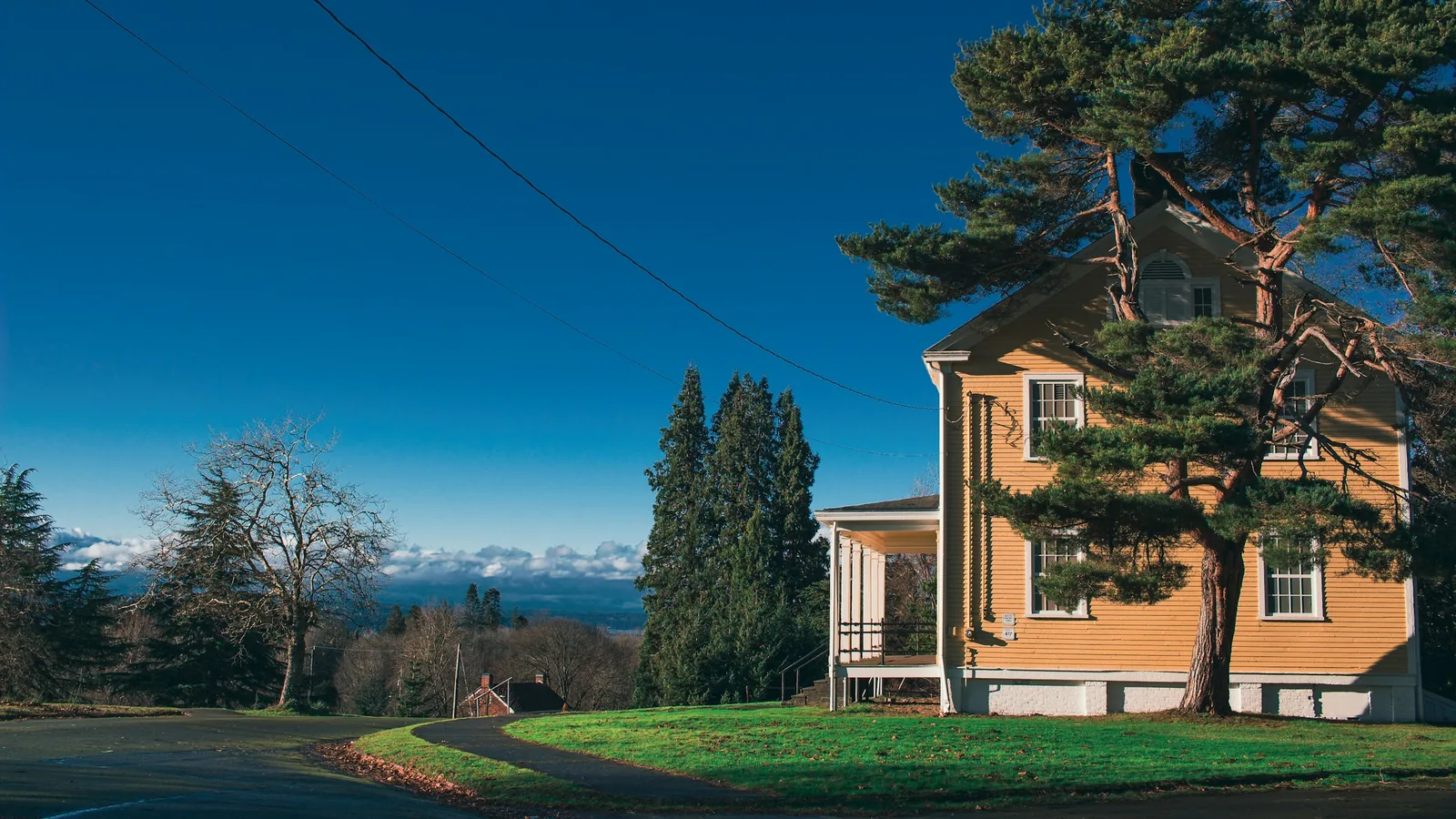 Yellow heritage home with mountain views