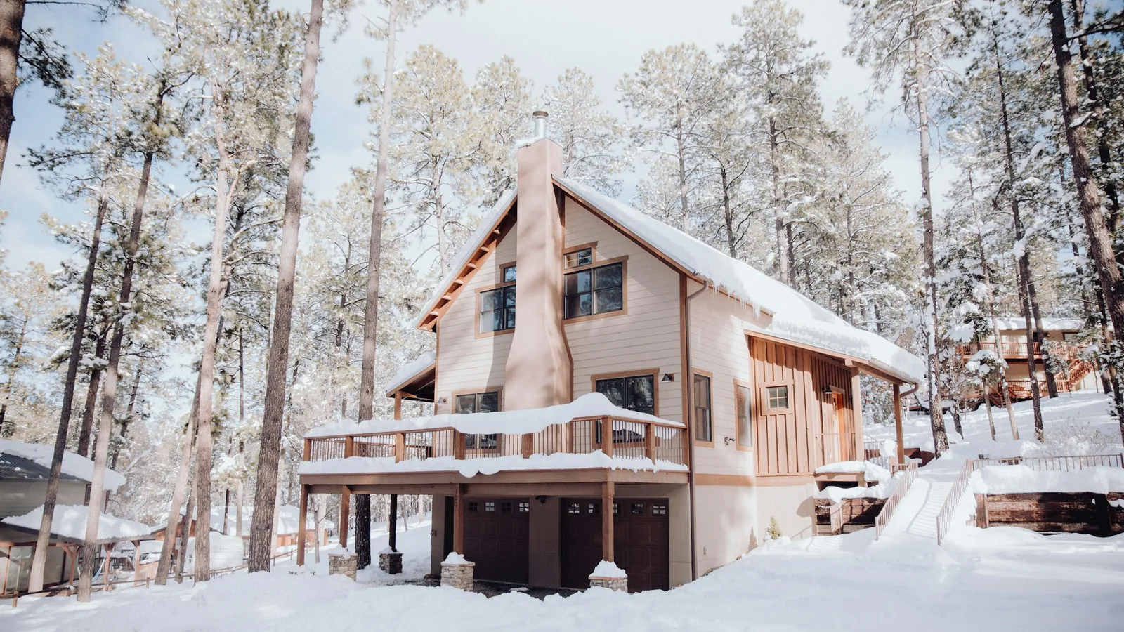 A house in the woods covered in snow, a detached home