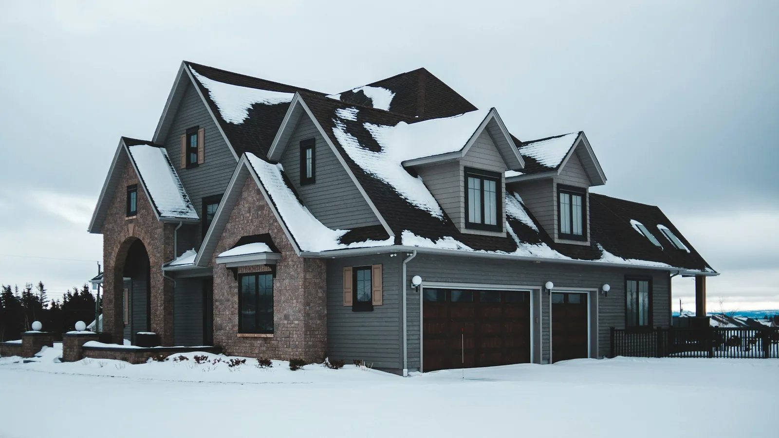 Gray house with garage in a detached home