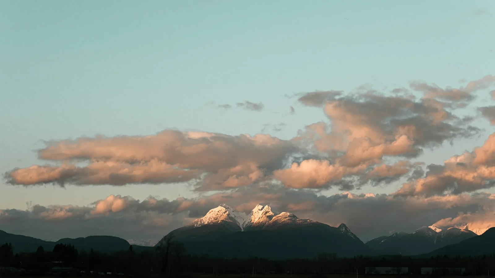 Golden Ears mountains at sunset seen from Langley