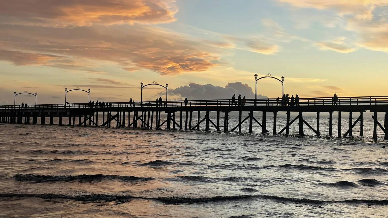 White Rock Pier silhouetted against a sunset over Semiahmoo Bay