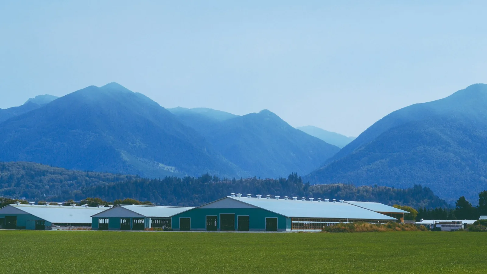 A farm with mountains in the background, Chilliwack