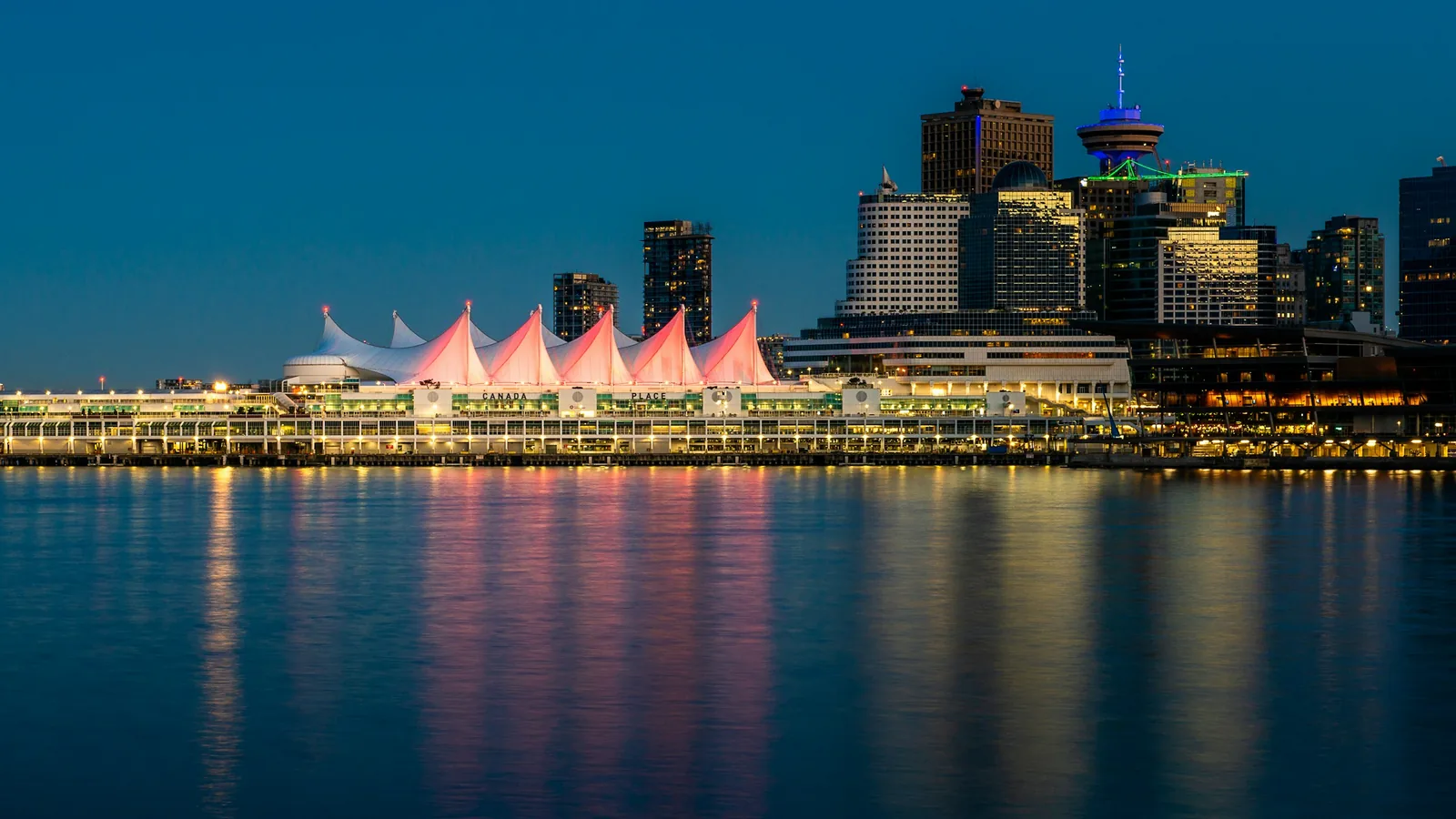 Canada Place sails lit up at night on the Vancouver waterfront
