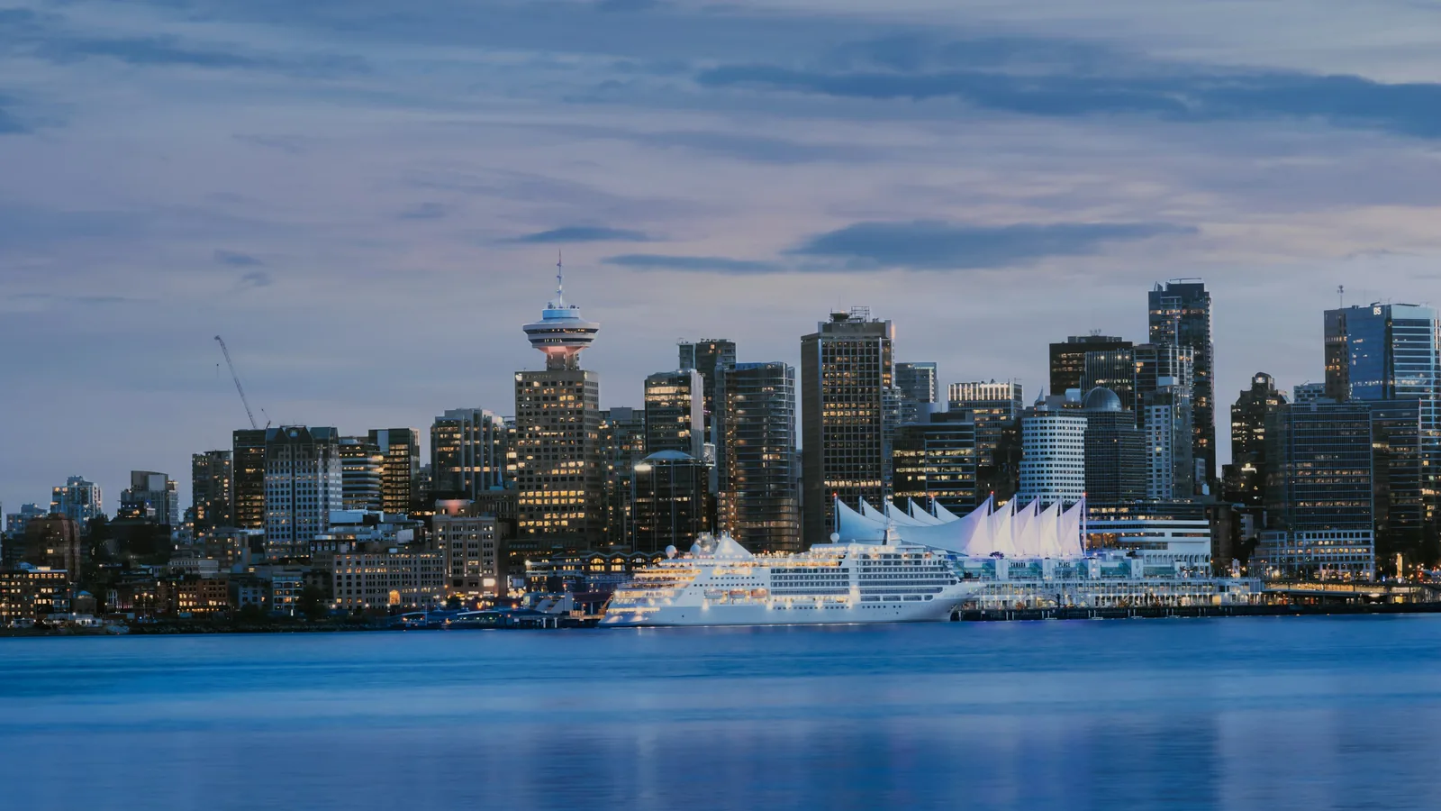 A city skyline with a body of water in the foreground, Vancouver