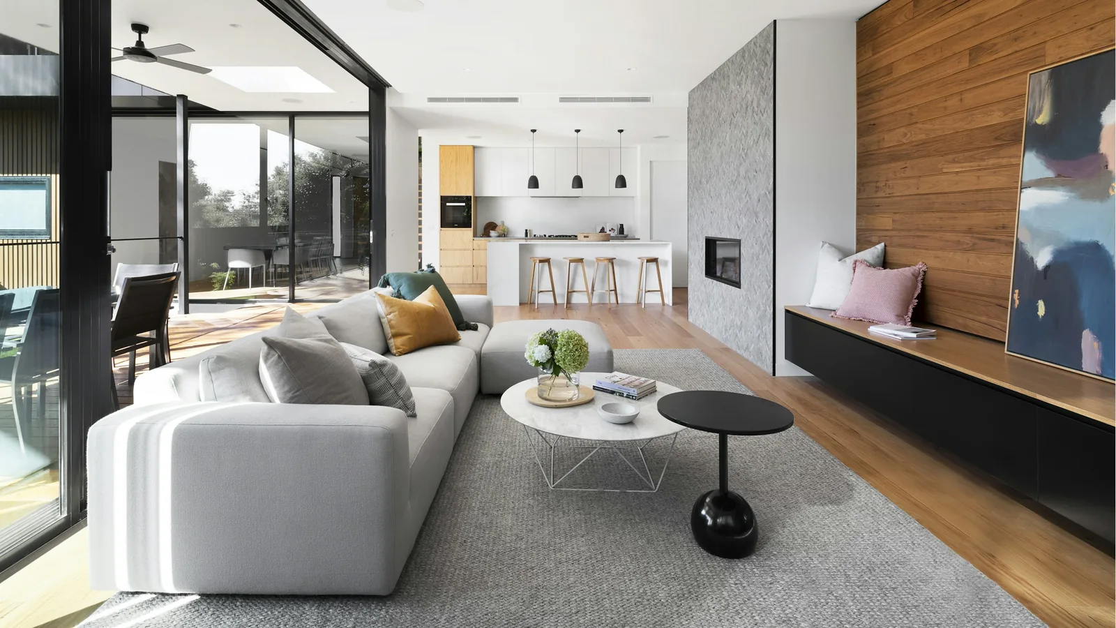 Modern open-plan living room with floor-to-ceiling windows