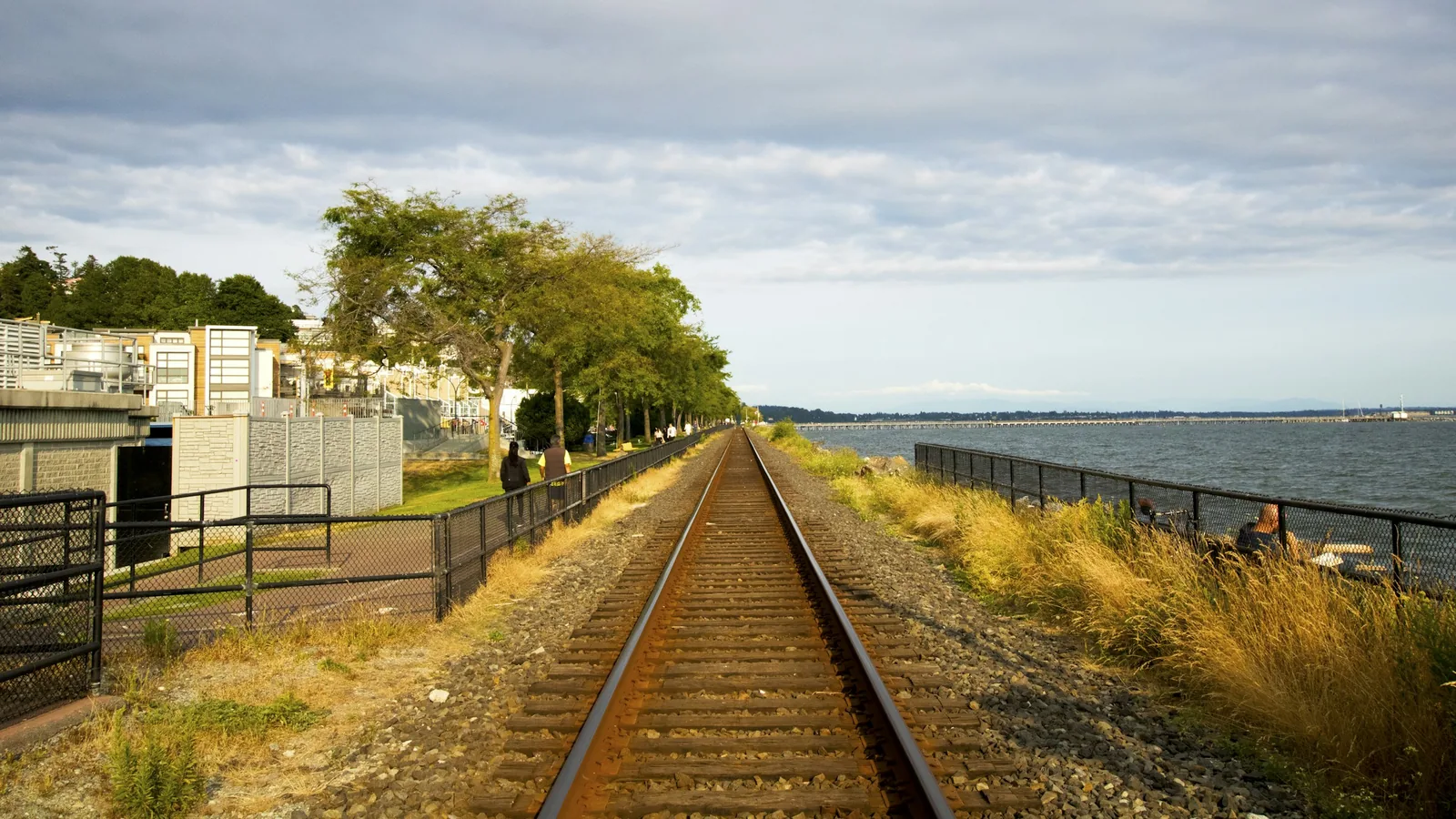 Train tracks next to a body of water in the White Rock waterfront