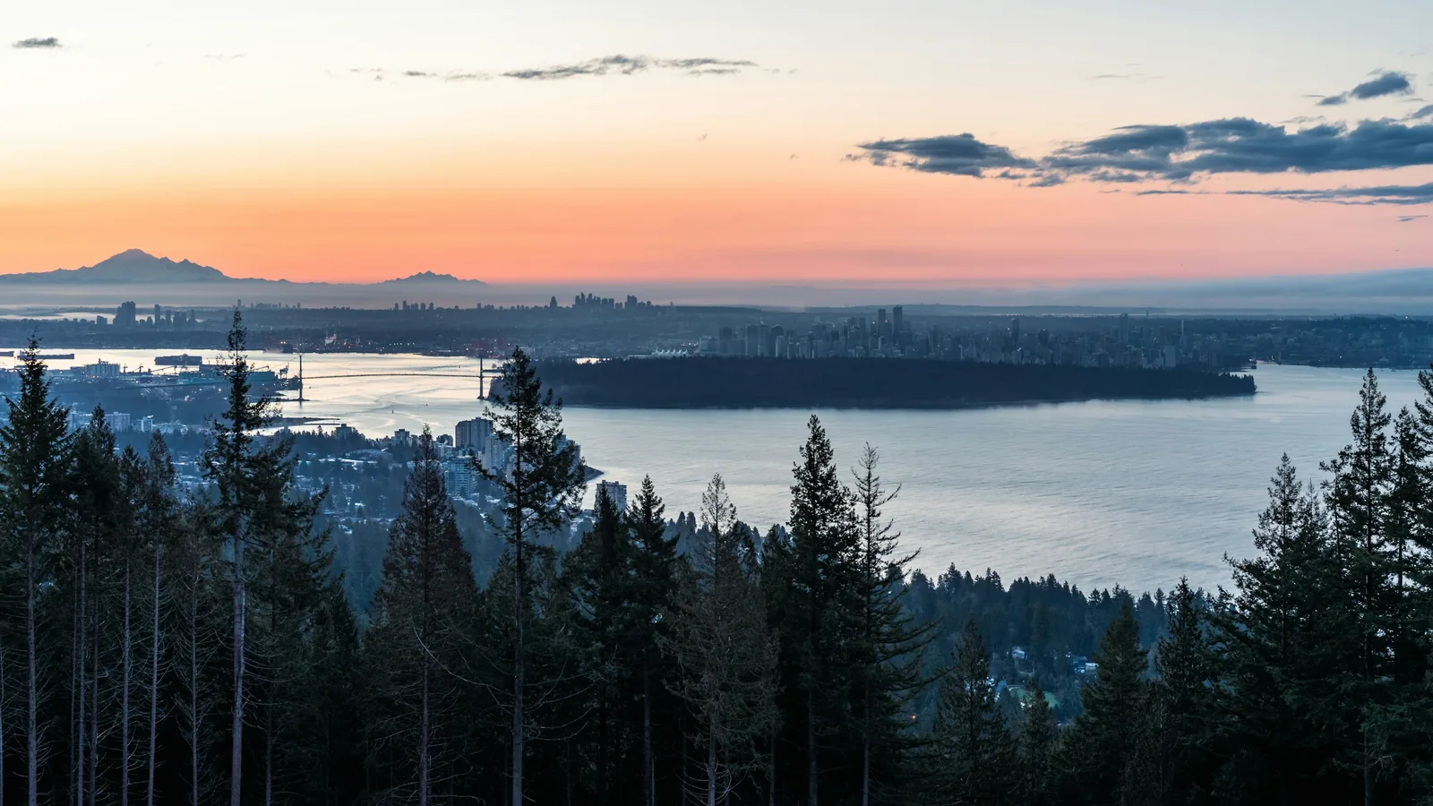 A sunset view of a city and a lake, Vancouver's North Shore