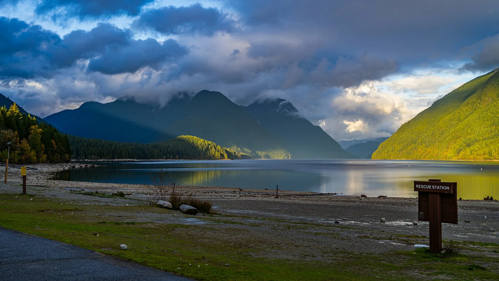 A body of water surrounded by mountains under a cloudy sky, Maple Ridge