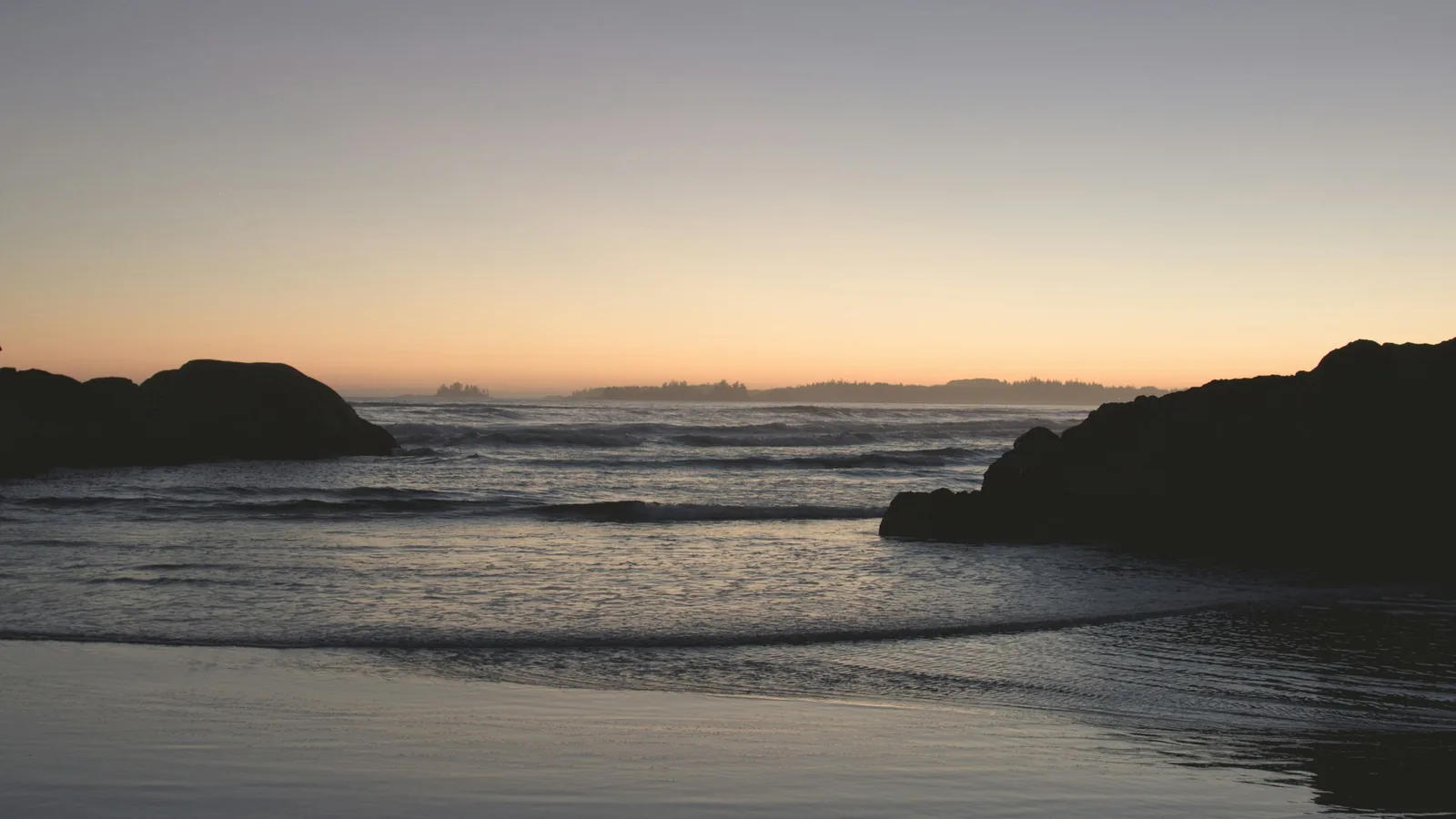 Rocky Pacific Northwest shoreline at sunset