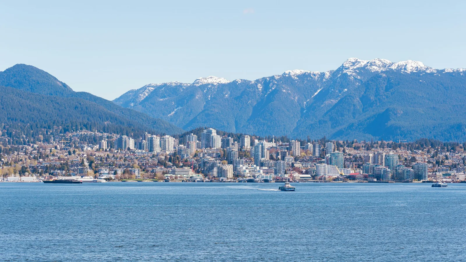 A large body of water with a city in the background, Vancouver's North Shore