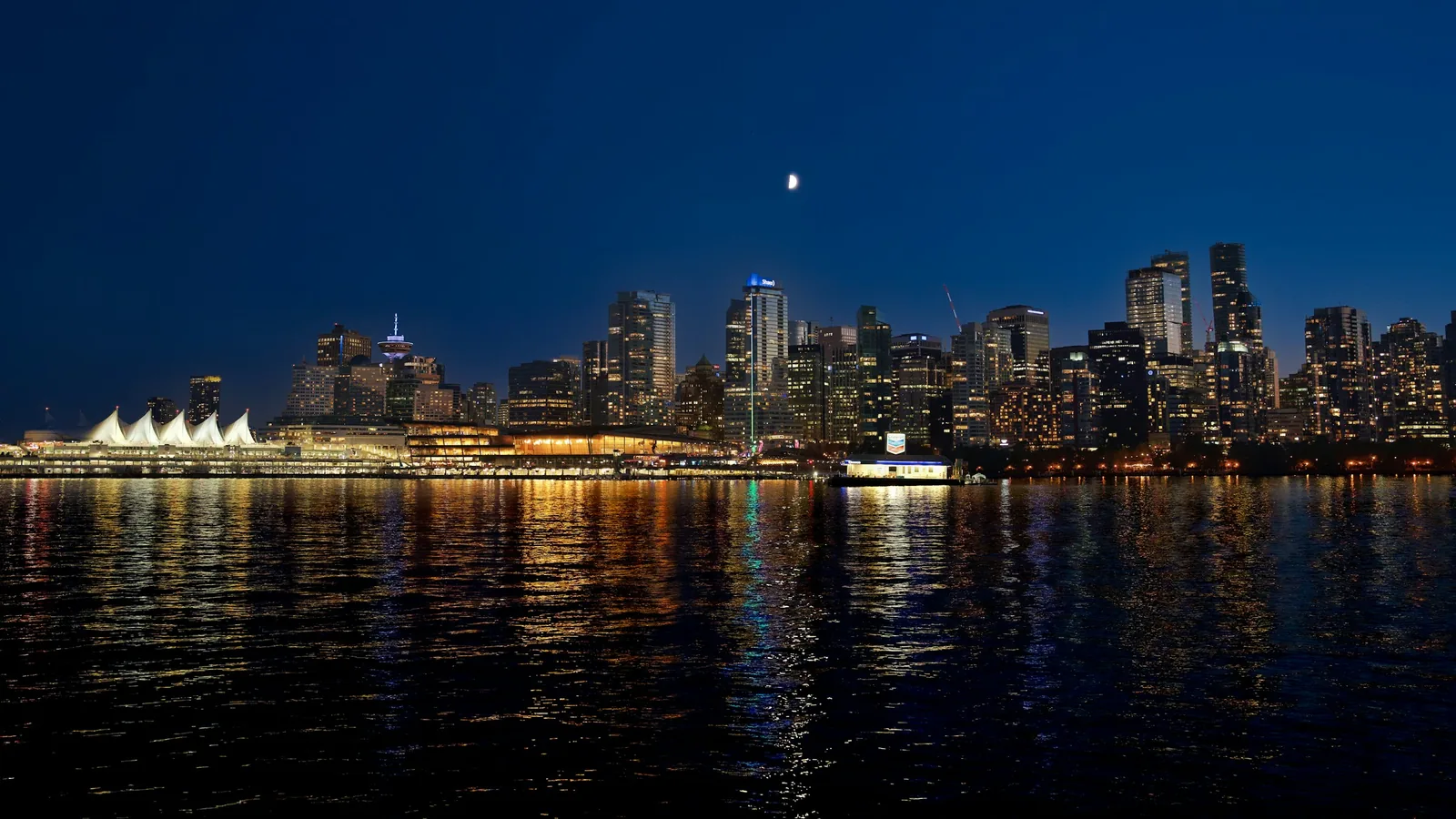 Vancouver skyline at night with Canada Place in the foreground