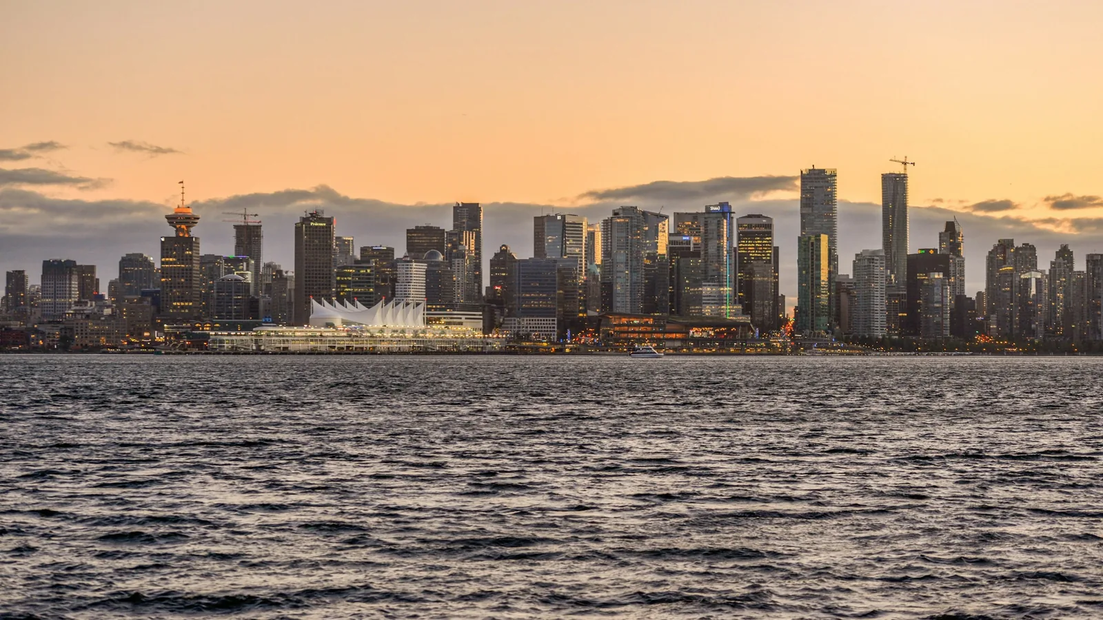 This shot was taken from North Vancouver, looking out over the water toward downtown Vancouver at sunset. The skyline, with Canada Place in 