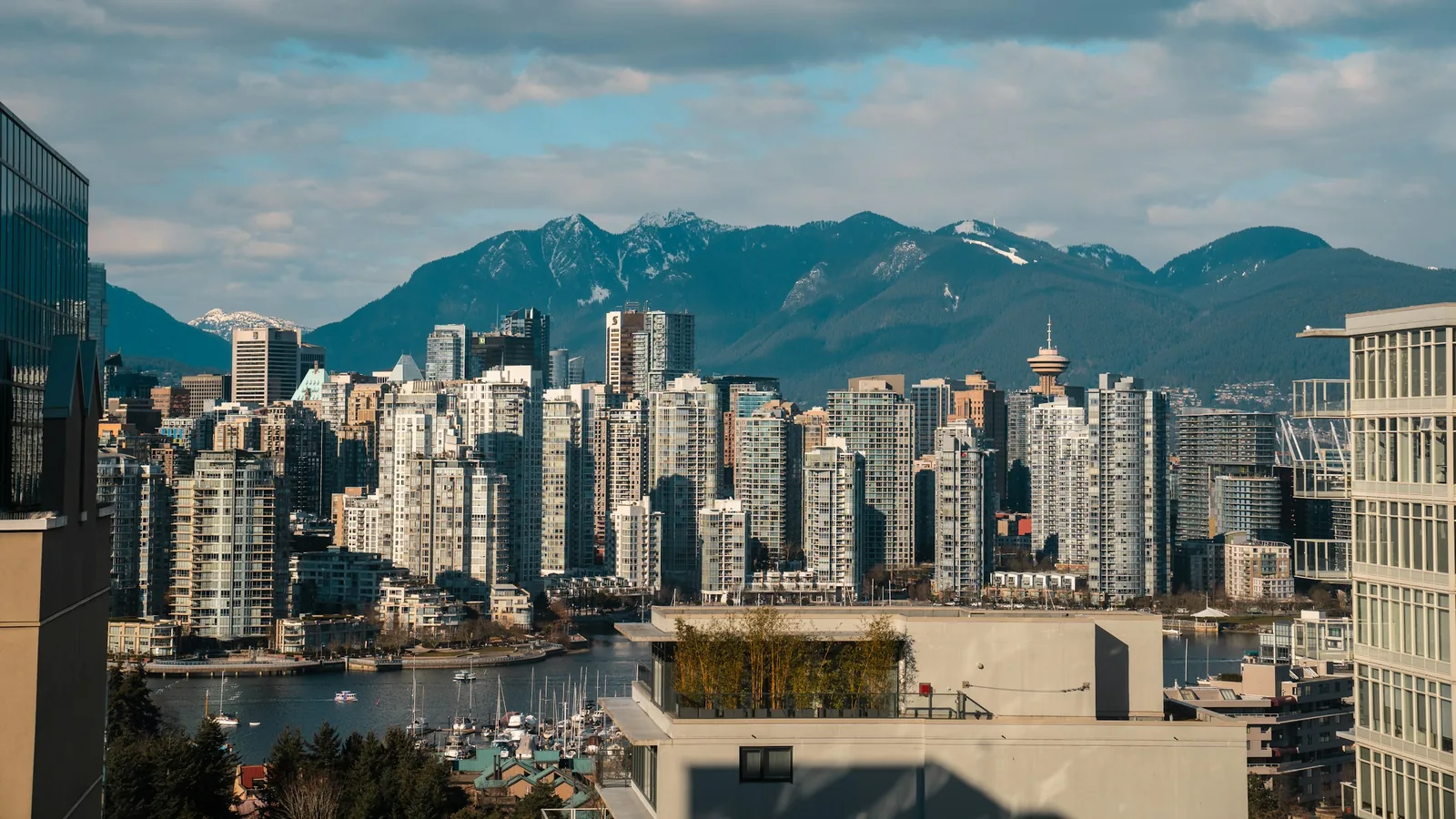 Vancouver skyline over False Creek with the mountains behind