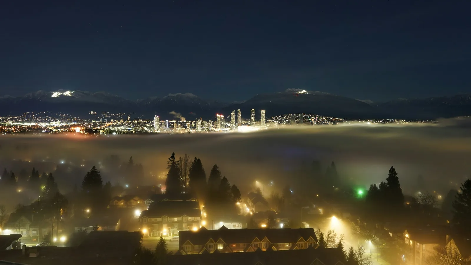 Fraser Valley lights under a layer of night fog