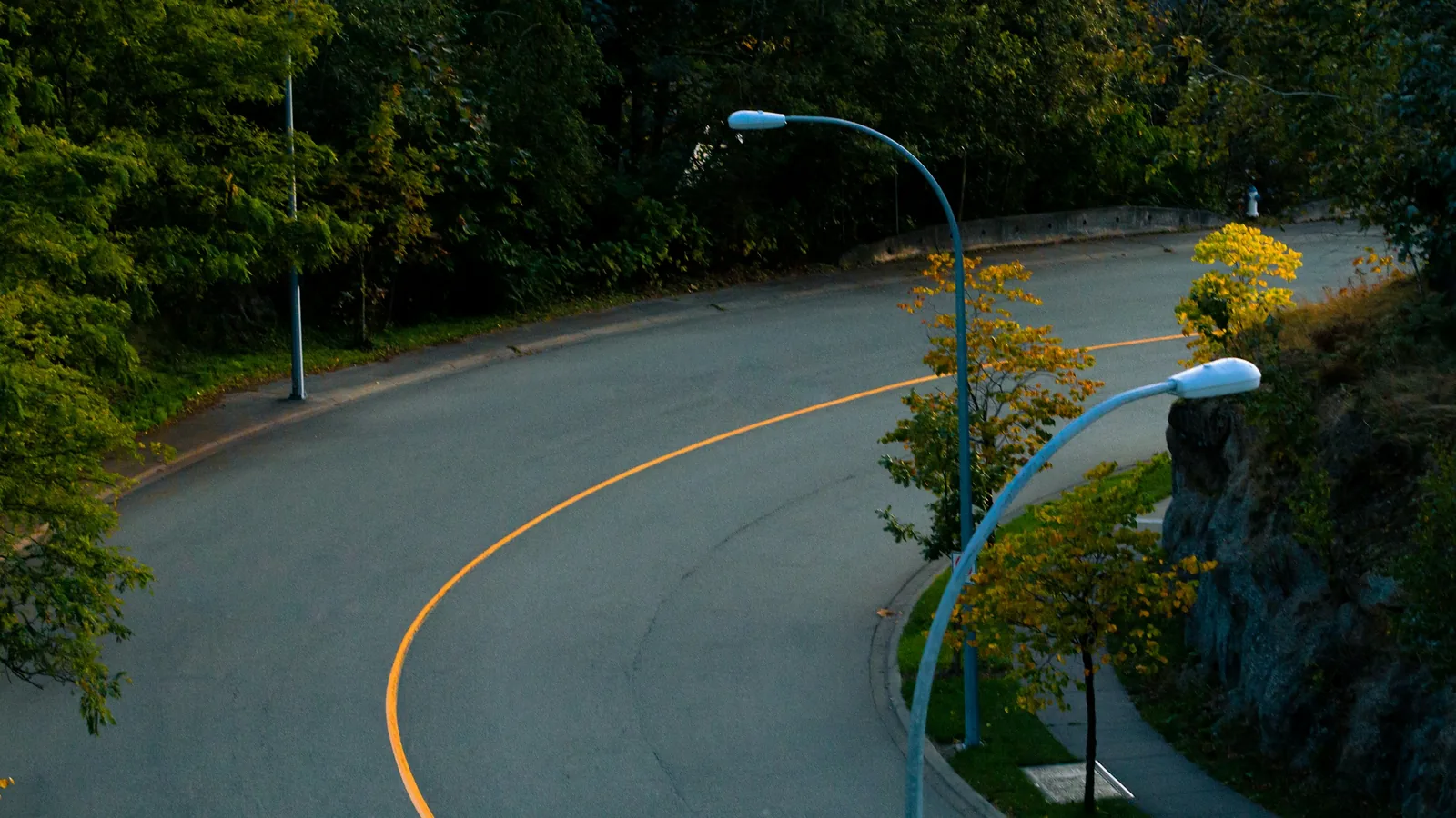 Road with yellow stripe winding around corner in Abbotsford