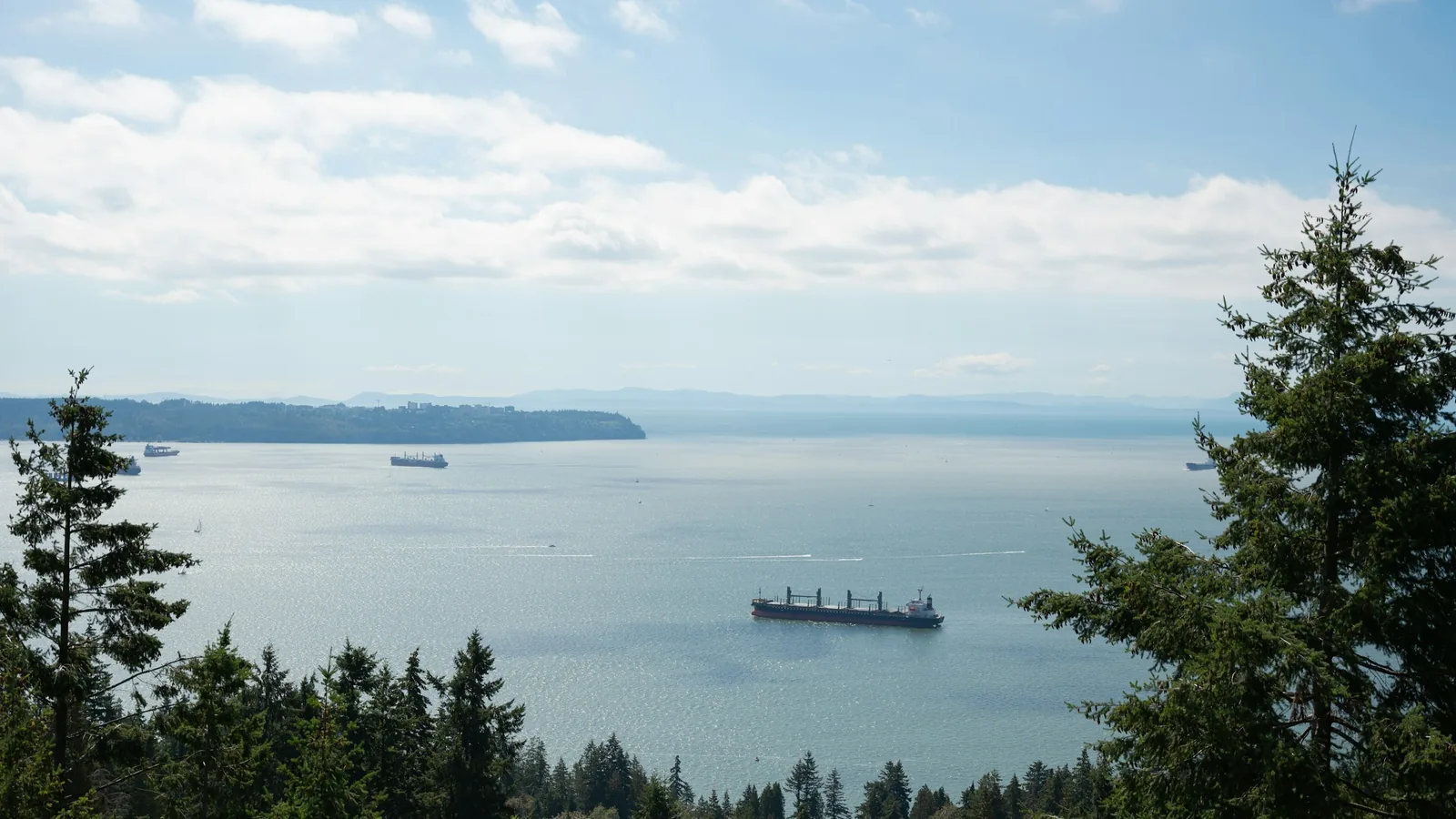 A large boat floating on top of a large body of water, Vancouver's North Shore