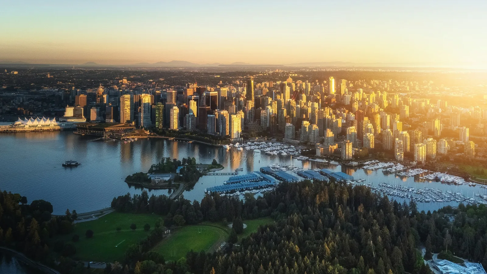 Aerial view of Coal Harbour, Stanley Park and downtown Vancouver at sunset