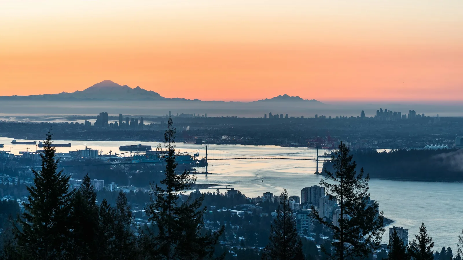 A sunset view of a city and a body of water, Vancouver's North Shore