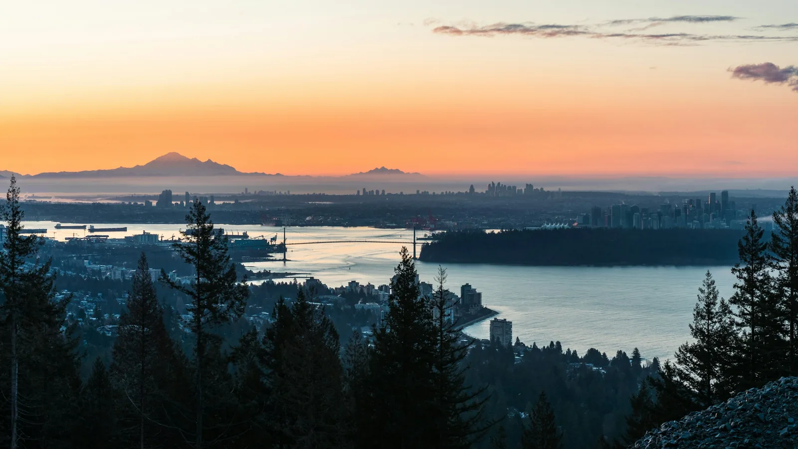 A sunset view of a city and a body of water, Vancouver's North Shore